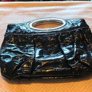 Nice looking clutch with metal handle and snap inside,  real clean, like new